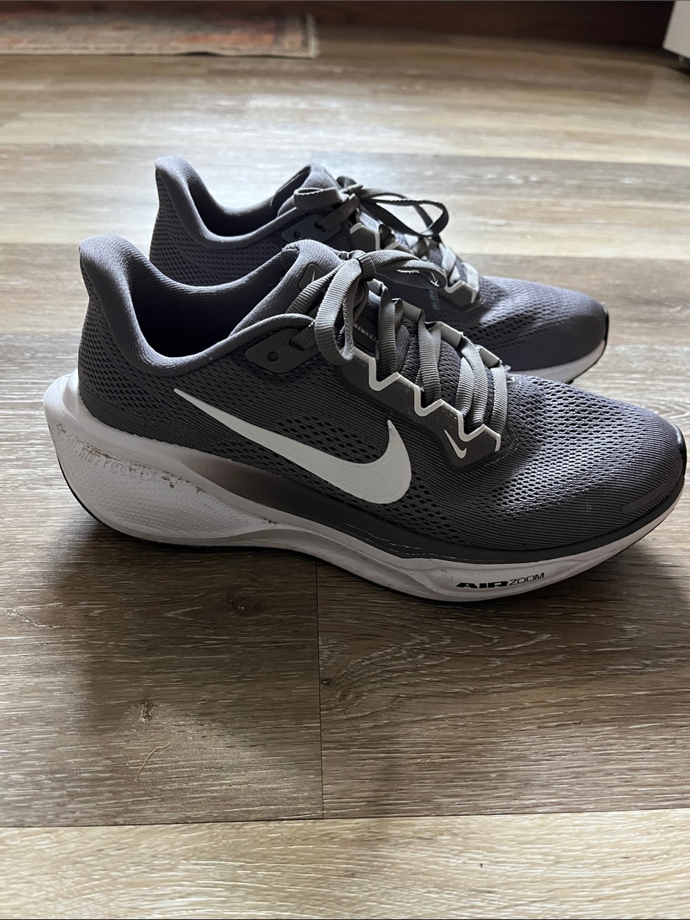 Nike Women’s Gray and White Running Sneakers